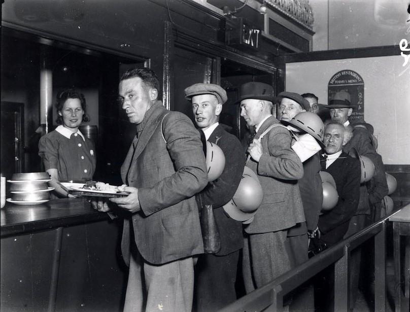 GRUB: A queue of hungry men forms when the public hall’s bar was used as a British Restaurant serving reasonably priced meals during the Second World War
