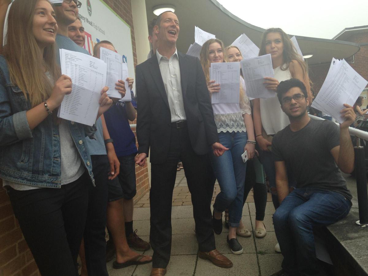 NUNNERY WOOD: Headteacher Steve Powell celebrates with successful GCSE students.