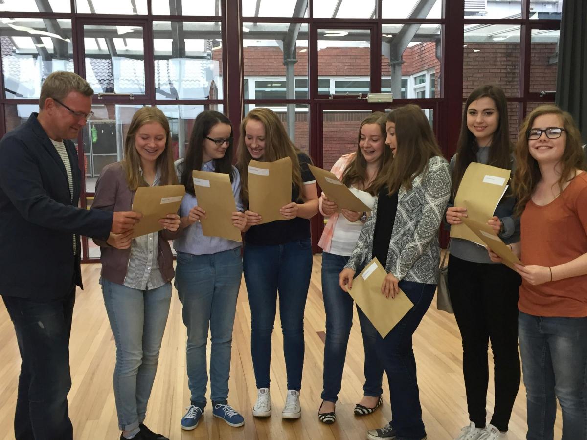 TENBURY HIGH: Nervous students open their results on Thursday morning. Picture by Tenbury High Ormiston Academy.