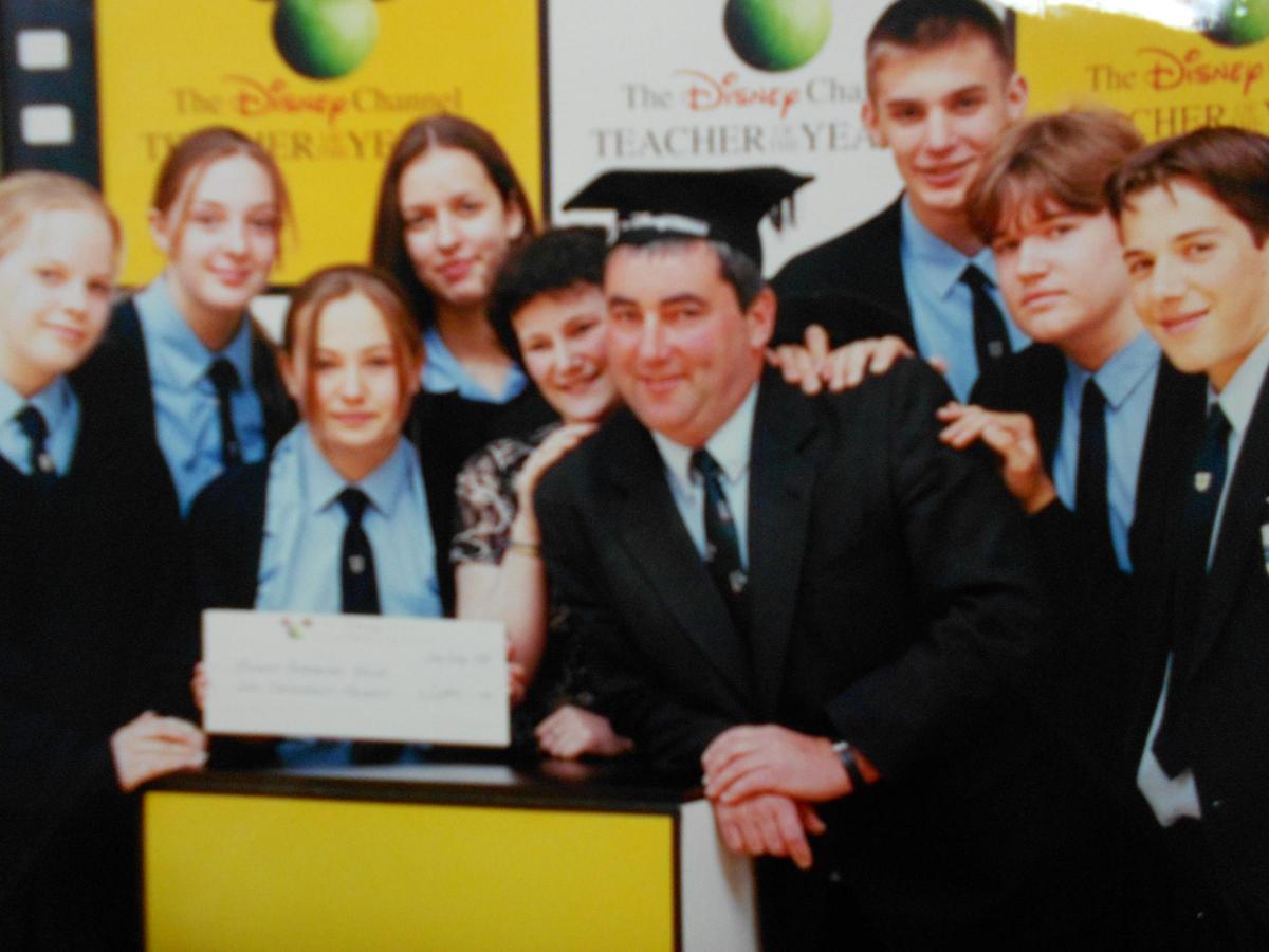Steve High collecting Teacher of the Year in 1997