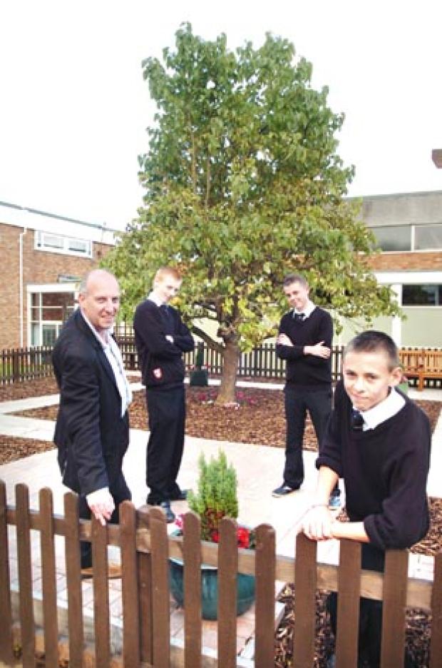 Helen Caroll’s son Nick opens the Caroll Courtyard at Chantry High School with pupils Dale Bissell, Ashley Topliss and Daniel Corbett.