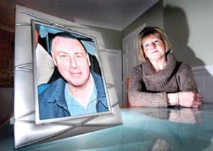 MEMORIES: Marilyn Morris, with a picture of her husband Tony, is full of praise for St Richard’s Hospice. Picture: 11164701