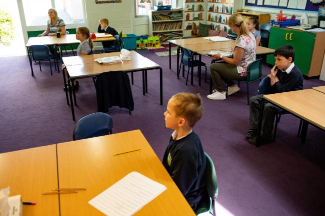 SCHOOL: Children of essential workers socially distance at Kempsey Primary School in Worcester. Pic. PA