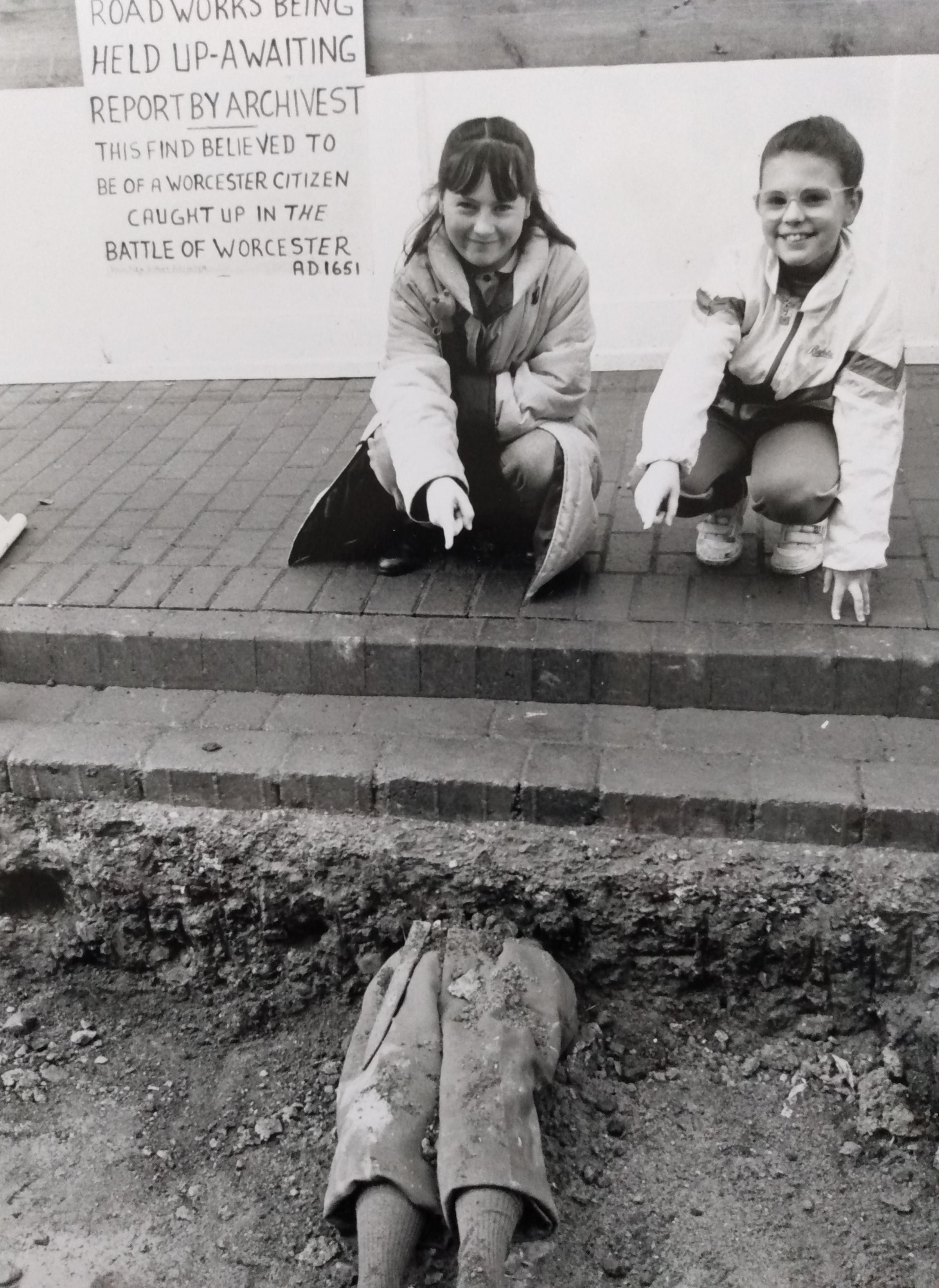Rebecca Cole, left, and Katie Box with a pair of legs left by a prankster during roadworks in March 1992. Turn inside for the full story
