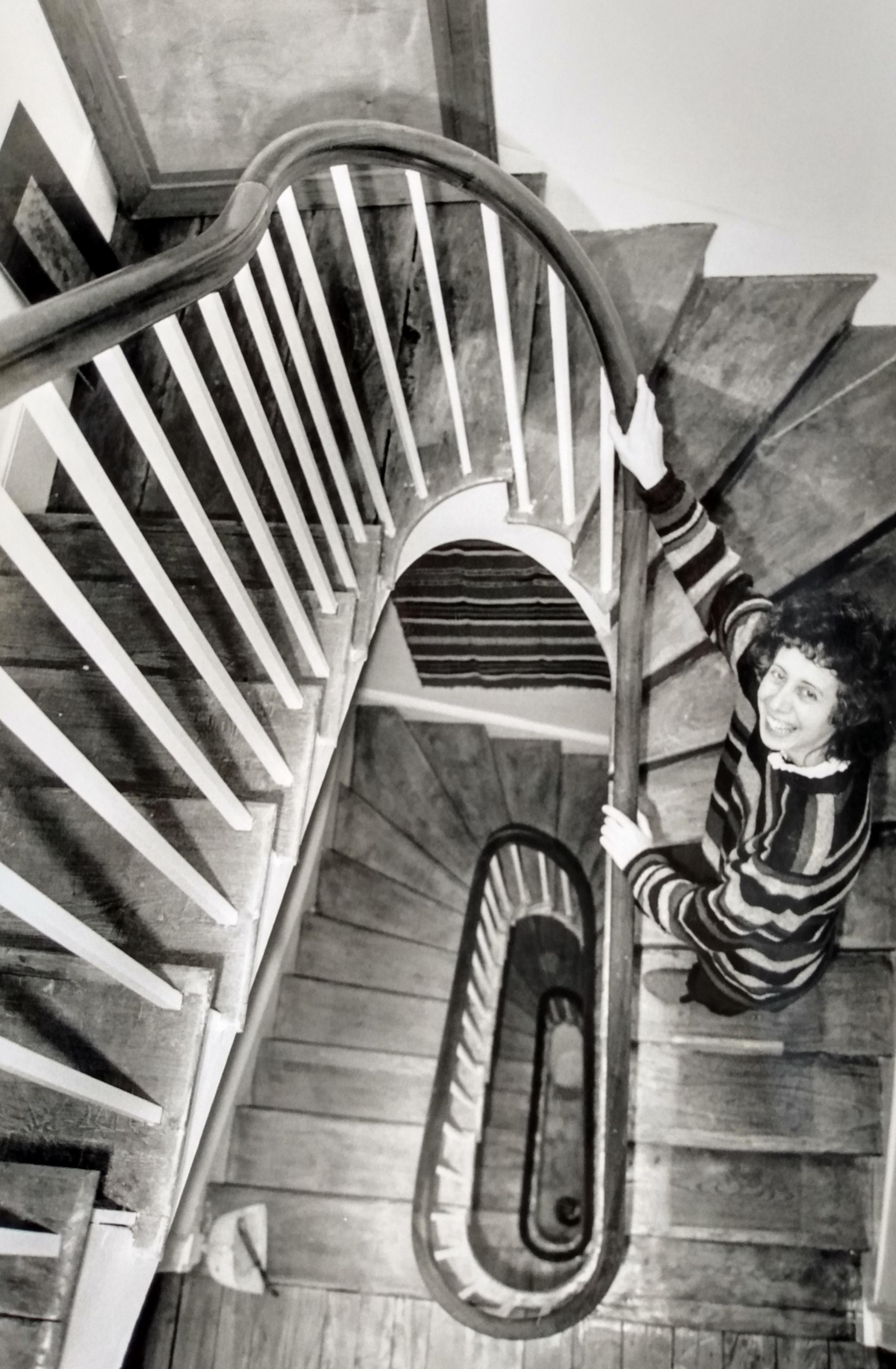 Jane Charles on the restored staircase of her restored Regency house on Rainbow Hill. She and boyfriend Chris Harper spent several yearsbringing it back to its former glory after it had lain derelict 