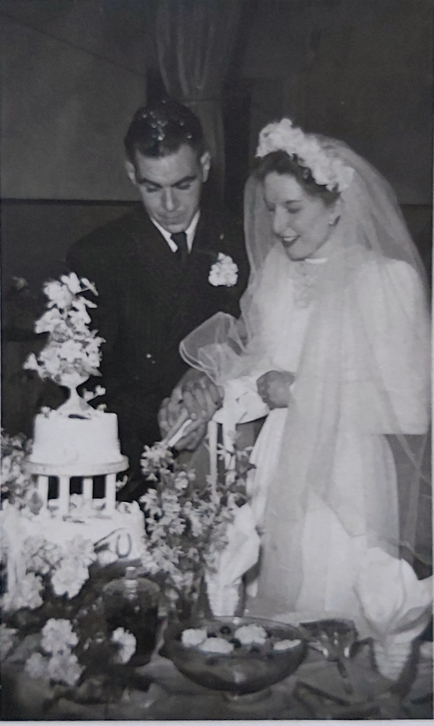 Roy and Eve cutting the cake on their wedding day in 1951