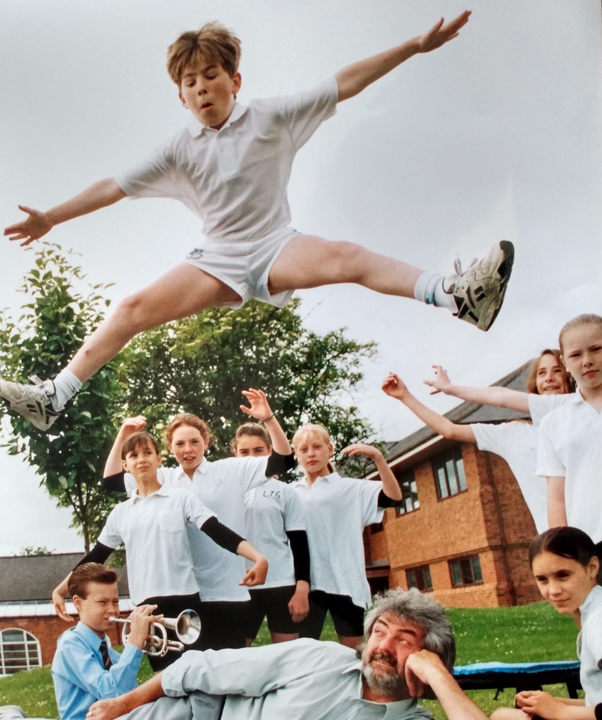 This picture from June 1994, with pupil Jim Hughes practising leaping into action for the School Show. The BBCs Mike George doesnt look convinced of the safety of everything