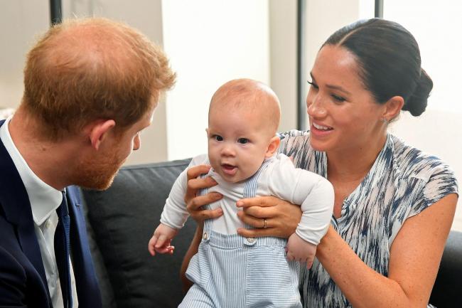 Duke and Duchess of Sussex holding their son Archie