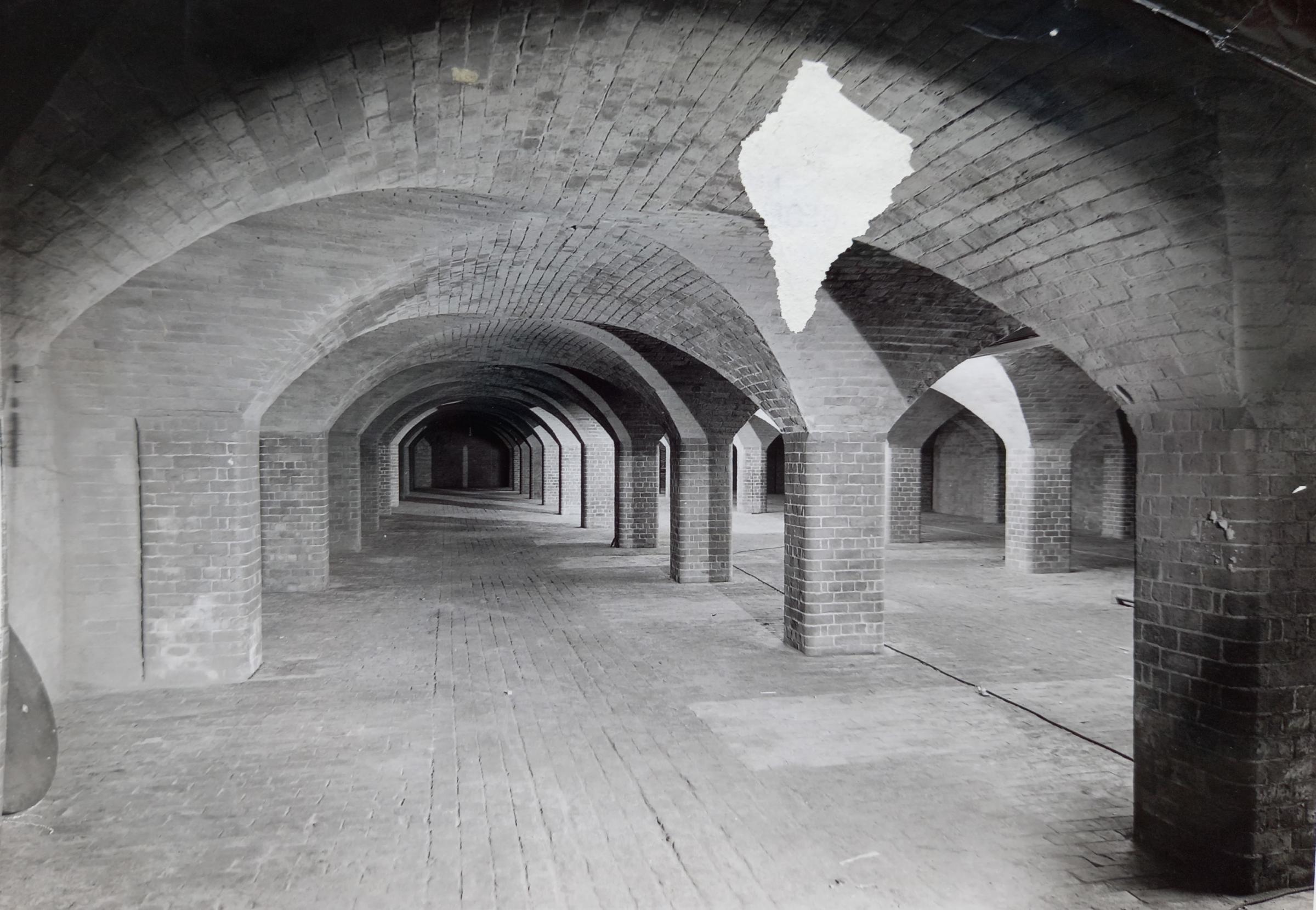 The factory’s cellars in the 1970s before conversion into the Mighty U home improvement store. The white mark is not a ghost, but damage to the print