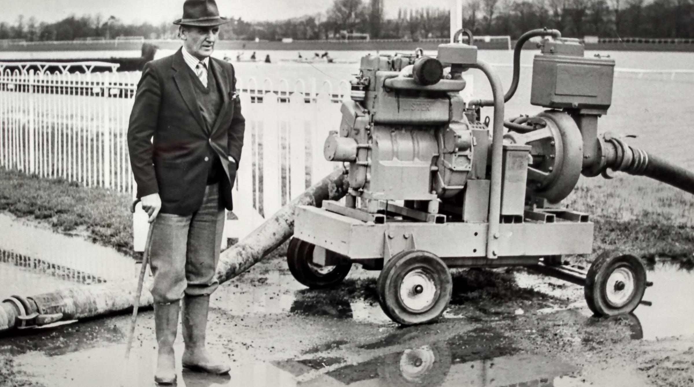 Racecourse manager Jack Bennett mans the pumps in December 1984 