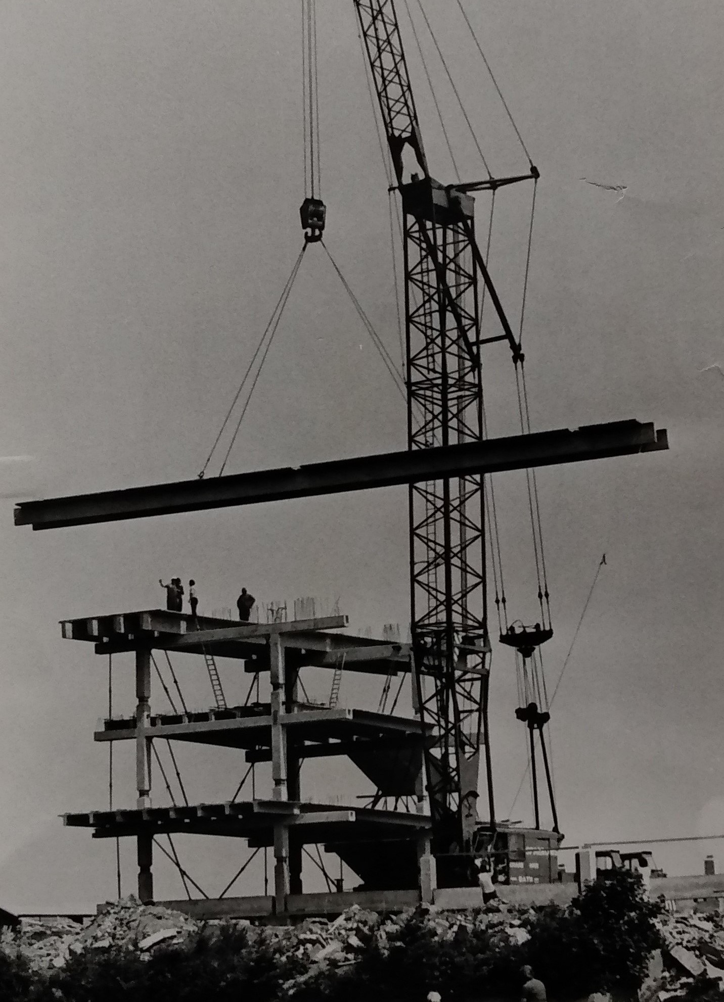 A jumbo-sized crane being used to swing girders into place during construction of the grandstand in June 1974