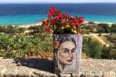 ART: A painted feta cheese tin used as a flower pot in Athitos