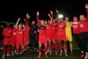 Kidderminster Harriers players celebrate after the Emirates FA Cup third round match at the Aggborough Stadium, Kidderminster. Picture date: Saturday January 8, 2022..