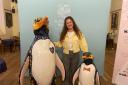 Artist Jess Perrin with penguins Spirit and Hoiho