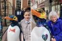 MAGIC: Ollyver-James Calder and Ann Fitzgerald could not resist a hug with the 'Waddle of Worcester' penguins to raise money for St Richard's Hospice