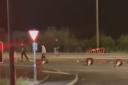 VIDEO: A group of men have been filmed throwing cones and barriers into the road in Kempsey.