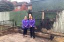 AFTERMATH: Nursery managers Michelle Morris (left) and Chloe Morris of Fairfield Day Nursery in the charred remains of the summer house which served as Santa's Grotto