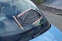 SMASHED: Neighbours said a car's windows have been smashed by vandals in St Johns.
