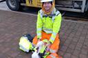 HURT: The Swan was hurt in Worcester city centre when it flew into a sign but Highways worker Steve Goodall soon came to the rescue