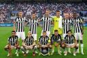 Newcastle United's players line up at the San Siro ahead of their opening game in this season's Champions League
