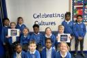 Students of Merton Infant School celebrate the success