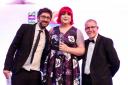AWARD: Ceremony host Mark Watson with award winner Ellie Harrison and Phil Arch, from Morgan Motors.