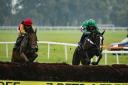 Orchard Thieves (left / Tom Scudamore) jumping the last upsides The Bottom Bar (Daryl Jacob). Picture: JTW Equine Images
