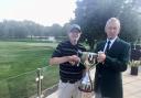 Captain Graham Whitehead (right) presents the Seniors Club Championship trophy to Steve Kirby (left) at the Vale.