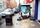 A street cleaner tackles litter which has been thrown on the ground – despite being just yards from a bin.
