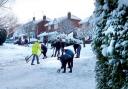 COMMUNITY SPIRIT: A team of about 20 people helped to clear the snow in Maytree Hill in Droitwich (Picture by reader Rachael Moore)