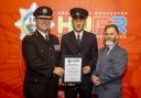 Josh Szikora-Warmington (centre) receives his certificate of commendation from Chief Fire Officer Jon Pryce (left) and chairman of Hereford & Worcester Fire Authority Councillor Kit Taylor