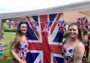 Lyndsey Davis (left) and Kirsty Parsons in the Union colours to mark the King's Coronation at the Broadheath Meadows party
