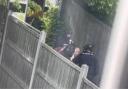 POLICE: Police were filmed restraining a man near Sainsbury's Blackpole.
