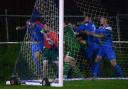 News: Pershore Town's Kirk Layton appears to be hit by one of the Coton Green replacements.
