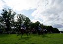 Horses and jockeys in action during Wacky Weekender Festival Pitchcroft 21st 23rd July Conditional Jockeys' Handicap Hurdle at Worcester Races