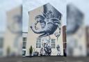 ARTIST: A world-famous artist painted a huge mural on a city business.