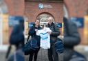 Charlotte Beauman-Evans, senior lecturer in physical education at the university, handed over 100 pieces of unused kits to regional collector for SOS Kit Aid Mark Newton