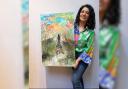 Worcester-based Nash Riazi pictured holding her painting, 'Endless Horizon'