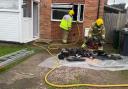 Fire fighters tackle the blaze that had ingulfed Mrs Summers' property in Malvern