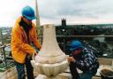 Stonemason James Mason works on the pinnacles with colleague Ryan Harris in 1994