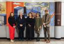 Sam McCarthy (Worcester BID), Fiona Saxon (Worcestershire Community Rail Partnership), Estee Angeline (artist), Maggie Keeble (The Arts Society Worcester) and Stacey Barnfield (The Colour Palette Company) with the bright composition