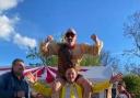 FUN: Paul Scarrott lifts up the Strongman on his shoulder at the Camp House Inn in Grimely