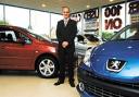 Sales executive Stuart Round at St Peter's Peugeot car dealership. Picture by Simon Rogers. 20035301