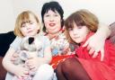 SO BRAVE: Dawn Pless with daughters Imogen, aged three, and, right, Camille, six. Picture: Nick Toogood. 11165401