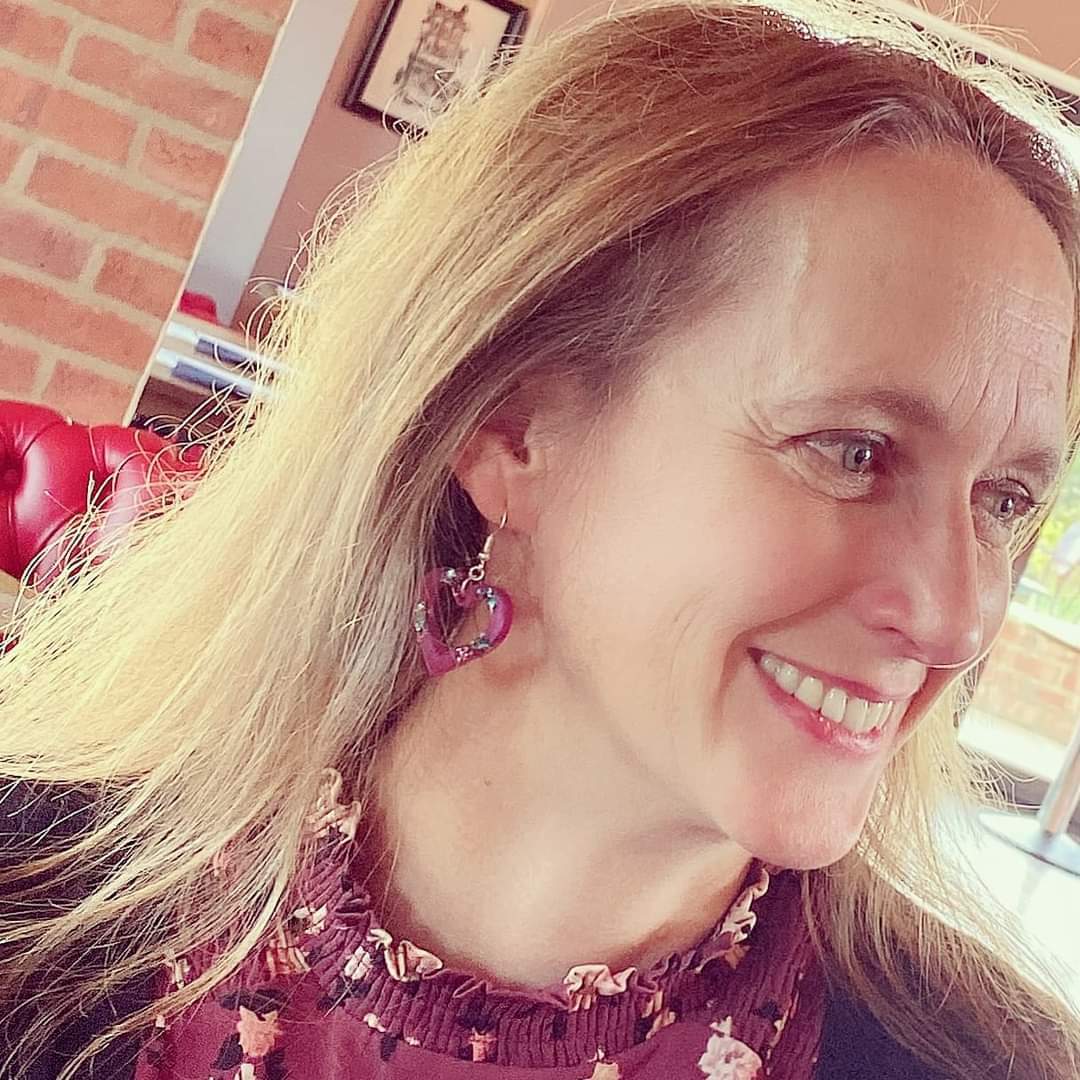 Sarah wearing some of the earrings from our Local Loveliness collection