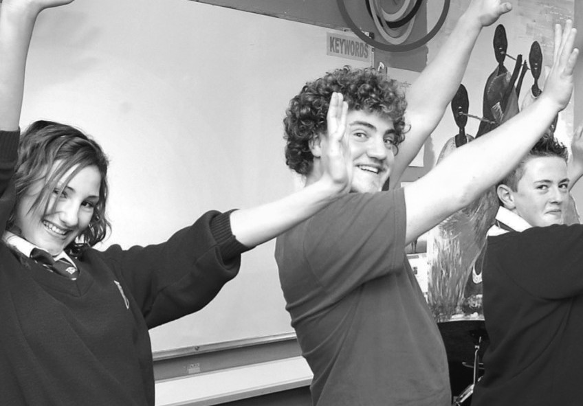 Blessed Edward Oldcorne pupils Philippa Harris and Martin King, both aged 13, are taught how to do a Hawaiian wave by Steve Carter as music and dance workshops to learn about religious education through music in September 2005 