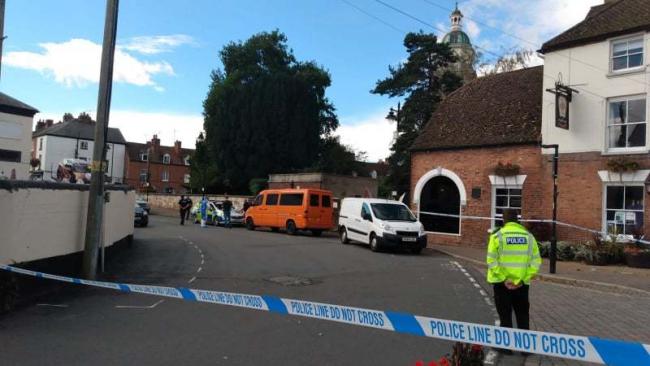 CORDON: Police outside the King's Head in Upton