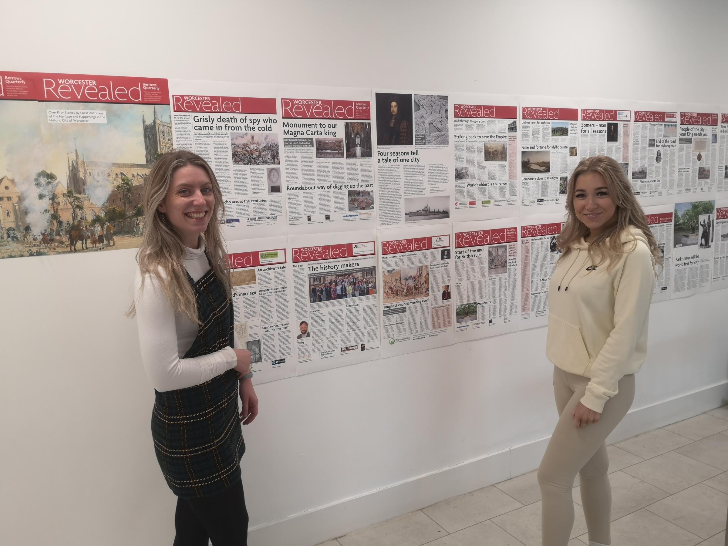 Students Georgia Davis(right) and Charlotte Taylor with the Worcester Revealed display at the Pod, which covers interesting happenings ancient and modern