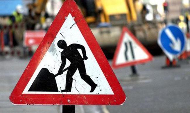 Emergency roadworks causing long delays on busy road near city centre