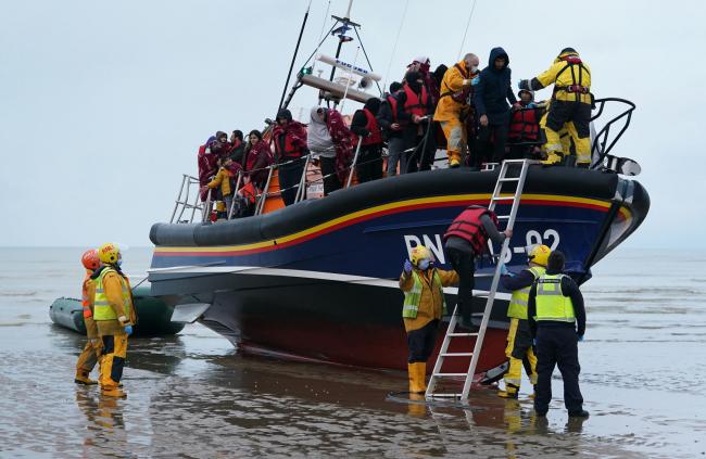 A group of people thought to be migrants are brought in to Dungeness, Kent, by the RNLI following a small boat incident in the Channel